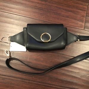 black fanny pack with gold colored accents
